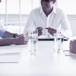 bigstock Smiling business people in mee 96690950 e1457318169602