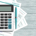 bigstock Uk Tax Form With Calculator Ly 113610671 e1457318844977